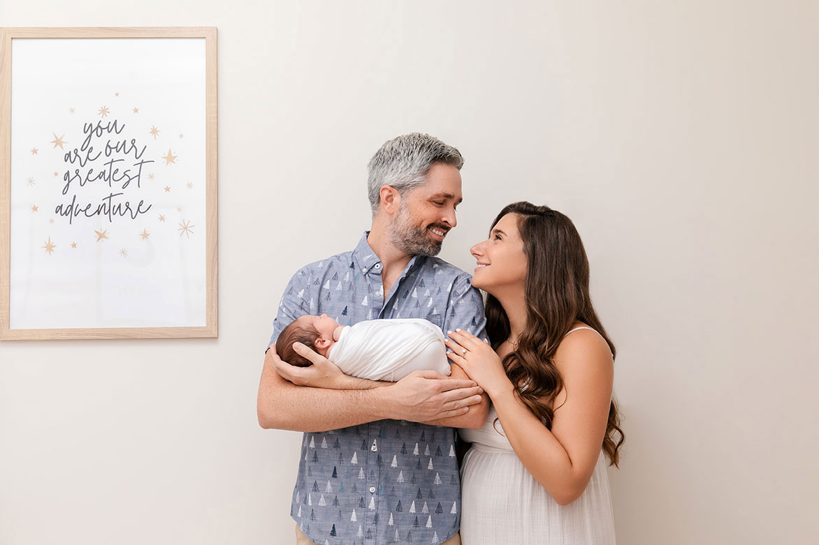 lifestyle poto of mom and dad with their newborn baby.jpg