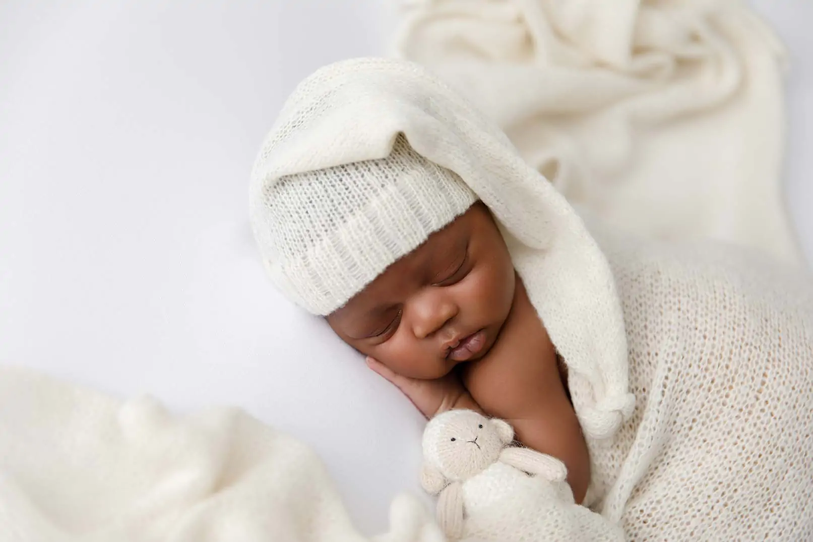 Studio quality newborn photography session in NYC by Love You Forever Photo, featuring professional in-home newborn portraits in Manhattan and Brooklyn.