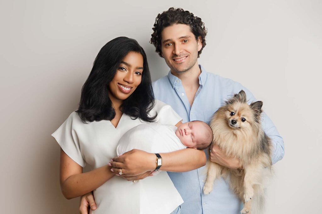 Studio quality newborn photography session in NYC by Love You Forever Photo, featuring professional in-home portraits of a newborn baby.